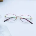 Women's metal full-frame optical glasses frame, elegant red and gold oval eyewear design. - Red Edges with Gold Frame / Plain