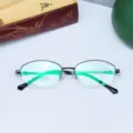Detail view of the titanium optical glasses frame with clear size marks on lens. - Black