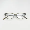 Detail shot of cat-eye anti-blue light glasses frame with translucent grey TR material. - Olive Green