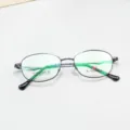 Classic oval metal eyeglasses frame detail view, lightweight business optical glasses. - Bright Black