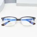 Men's half-rim optical glasses frame with clear demo lenses, stylish black and gold design. - Black & Gold