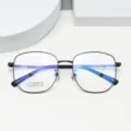 Detail view of stylish polygon metal eyeglass frames, showcasing titanium build and clear fit. - Bright Black