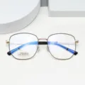 Detailed close-up of the stylish polygon titanium eyeglasses frame showing clear lens specs. - Black & Gold