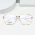 Detailed view of polygonal metal optical glasses frame in rose gold, lightweight titanium. - Rose Gold