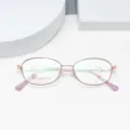 Detail view of ultra-light women's optical glasses frame featuring elegant purple oval rims. - Purple Gold
