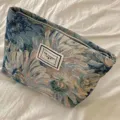 Vintage woven floral cosmetic bag with zipper closure and stylish label, portable makeup pouch. - Monet Blue Oil Painting Floral