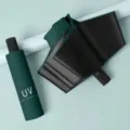 Detailed view of the dark green portable UV protection folding umbrella case and fabric texture. - Manual Open UV Dark Green