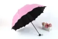 Pink folding sun umbrella with black UV-blocking lining and magic blossom water pattern. - Radius: 55cm * 8K Umbrellas / Pink