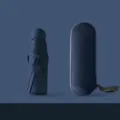 Compact 5-fold capsule umbrella in navy blue with portable case for travel sun rain protection. - Round 8-Rib Sun Umbrella, Navy Blue (Full Blackout)