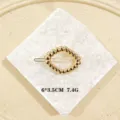 Fermaglio per capelli ovale geometrico dorato da donna, elegante accessorio in metallo 6x3.5cm - Torsione Irregolare / Oro