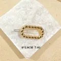 Fermaglio per capelli in metallo dorato geometrico ritorto, elegante accessorio. - Ovale Intrecciato / Oro
