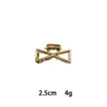 Detail view of the miniature gold alloy hair claw clip, featuring a geometric bow shape. - Bowknot Style (1162-10) / Gold