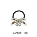 Silver alloy cross hair tie with cute cherry charm elastic band for women hair styling. - Crossed Cherry Style (1116-15)