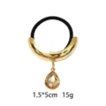 Gold alloy crescent hair tie with sparkling teardrop rhinestone pendant, elegant black elastic. - Crescent Rhinestone Style (1116-47)