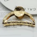 Gold metal hair claw clip with zodiac and globe pattern, minimalist geometric design detail. - Round-Tip Crescent 8cm Gold