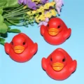Detailed view of red LED flashing floating bath duck toy, perfect water sensor kids shower toy. - Red