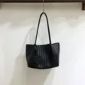 Black woven leather shoulder bag with cute heart charm, elegant underarm daily tote. - Black
