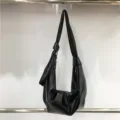 Black faux leather slouchy shoulder bag, casual hobo dumpling bag with knot detail. - A Black - Patent