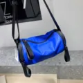 Blue nylon barrel shoulder bag detail, waterproof crossbody bag with dual zippers. - 181 Waterproof Blue