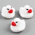 Cute white rubber floating ducks toy set with red beaks for baby bath time fun playing. - Glowing White Ducks