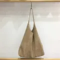 Vintage suede hobo shoulder bag detail view, showing soft large capacity slouchy design texture. - Velvet Apricot