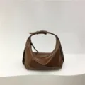 Detailed view of the stylish brown soft leather dumpling underarm shoulder bag design. - Brown