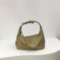 Minimalist soft texture dumpling underarm bag detail, chic commuter single-shoulder crossbody design. - Apricot