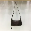 Brown minimalist soft dumpling shoulder bag detail, stylish commuter crossbody design for daily wear. - Coffee Velvet
