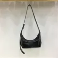 Minimalist black leather dumpling underarm shoulder bag, soft texture, casual commute style. - Black