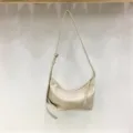 Soft leather dumpling hobo bag detail view minimalist underarm style for daily commuting use - White