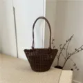 Stylish dark brown woven leather shoulder bag, trendy hollow bucket bag for women daily use. - Coffee
