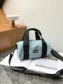 Lightweight blue canvas barrel bag, casual sport crossbody and shoulder bag with black straps. - Light Blue