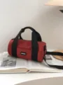 Red canvas barrel shoulder bag, casual commuting sports crossbody bag with black straps. - Red