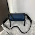 Dark blue nylon cylindrical crossbody bag, minimalist barrel shoulder bag for daily casual wear. - 181 Waterproof Navy Blue