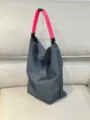 Grey canvas tote bag with vibrant pink rope handles and stylish black strap details. - Rose Red Strap / Gray