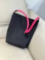 Casual black canvas bucket bag with vibrant pink rope handle, lightweight daily shoulder bag. - Rose Red Strap / Black