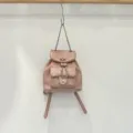 Pink quilted leather backpack with chain straps and chic turn-lock closure for daily casual wear. - Pink
