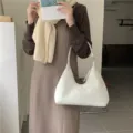 White plush hobo shoulder bag detailed view, soft furry crescent design for women. - White