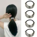 Close-up detail shot of silver curved metallic ponytail holder with elastic hair tie accessory. - Ponytail Holder (Set 27) / Set of 4 / Silver