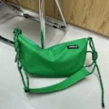 Green oxford cloth dumpling shoulder bag with trendy side knots, casual sports crossbody design. - Green