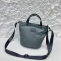 Waterproof nylon bucket bag detail view, casual crossbody design with durable fabric and strap. - Green
