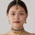 Closeup of bohemian blue stone gold coin choker necklace and earrings set detail view. - Blue