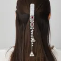 Detailed shot of a vintage Chinese-style silver long tassel hair clip with rhinestones and pearls. - Style 3