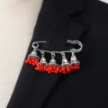 Bohemian retro bell tassel brooch detail, elegant silver safety pin with red bead charms. - Red