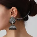 Stunning bohemian Indian ethnic style silver jhumka earrings with stylish hair chain design. - Black