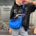 Trendy blue nylon crossbody dumpling bag with knot design, large capacity and lightweight. - Blue