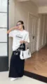 White casual shoulder bag detail showcasing large capacity design, comfortable strap and zipper pulls. - Waterproof Material / White