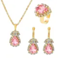 Detailed view of the luxury pink crystal jewelry set featuring sparkling rhinestone halo details. - Pink