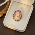 Retro court style cameo brooch, oval pink lady relief with delicate silver filigree frame detail. - Style 5