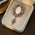 Vintage medieval court cameo brooch with rhinestone inlay and pink pendant. Fashion jewelry. - Style 6